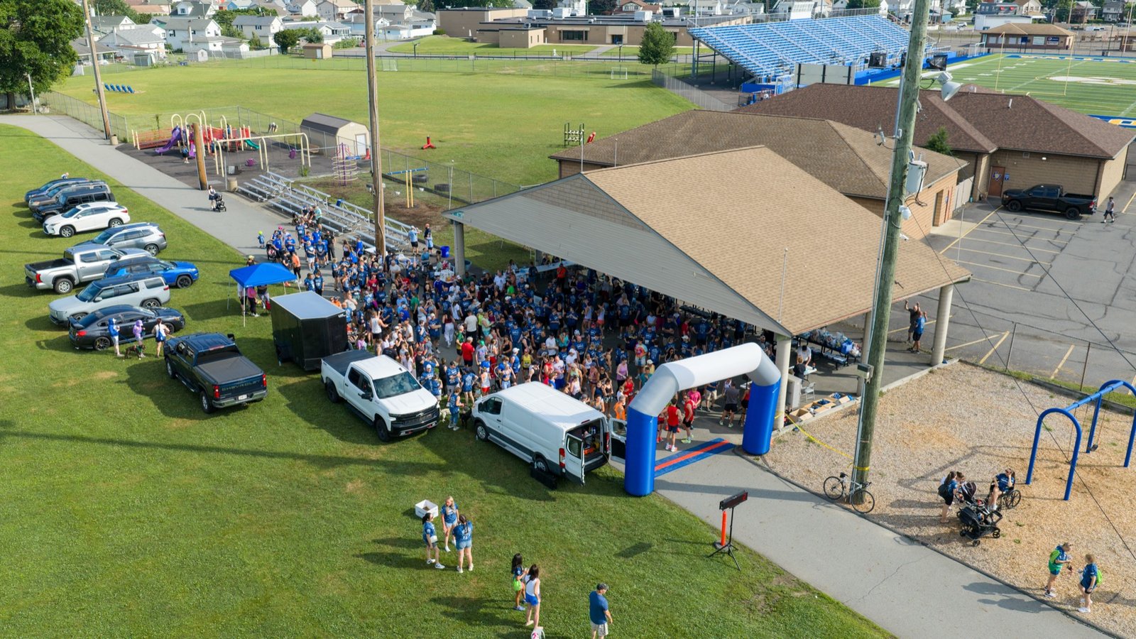Crowd gathered at a community 5K start line